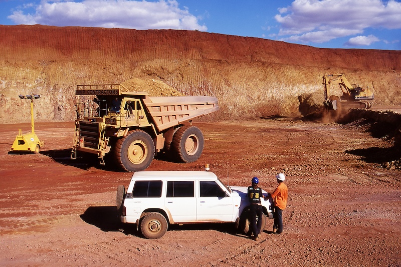 trucks working at a mine site using GPS technology